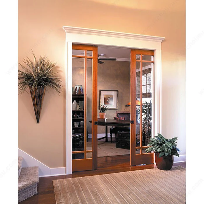 Ensemble de quincaillerie pour porte coulissante escamotable ou apparente